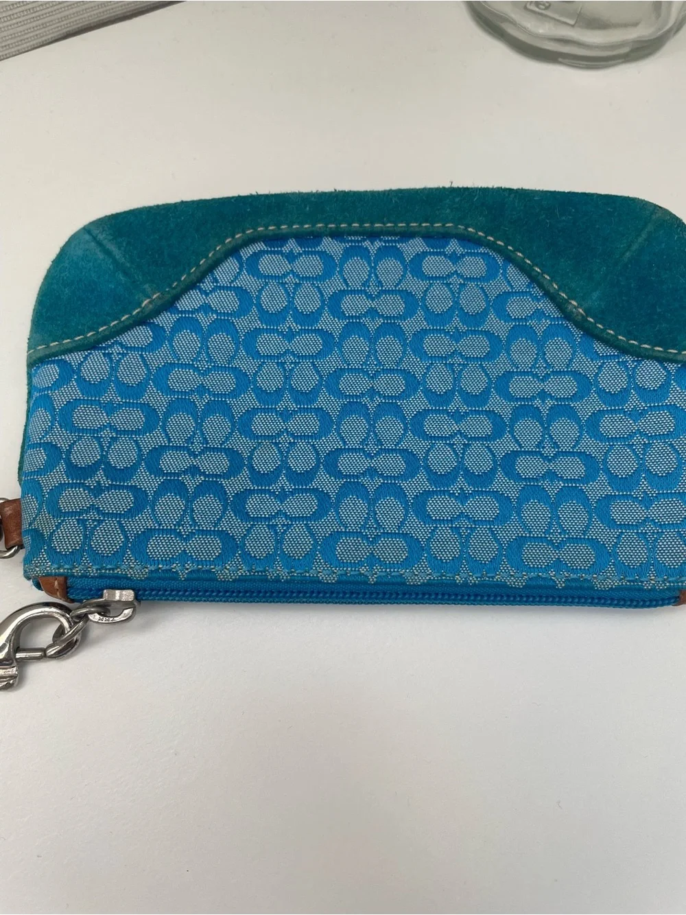 Coach Vintage Wristlet with Suede on the bottom.